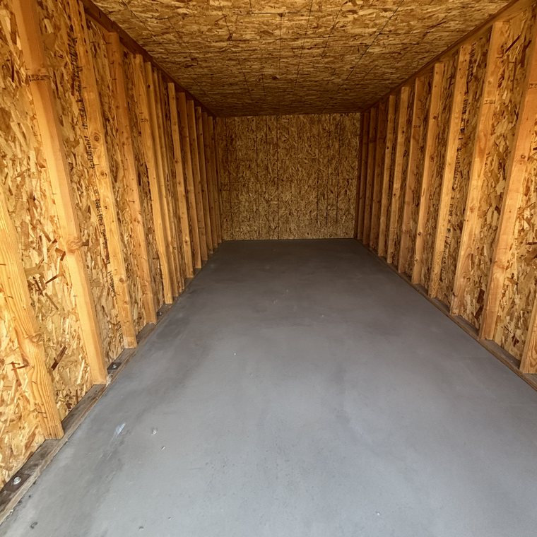 Garage cleanout after — emptied and swept